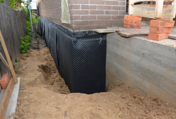 Happy homeowners after waterproofing job in Bayou La Batre